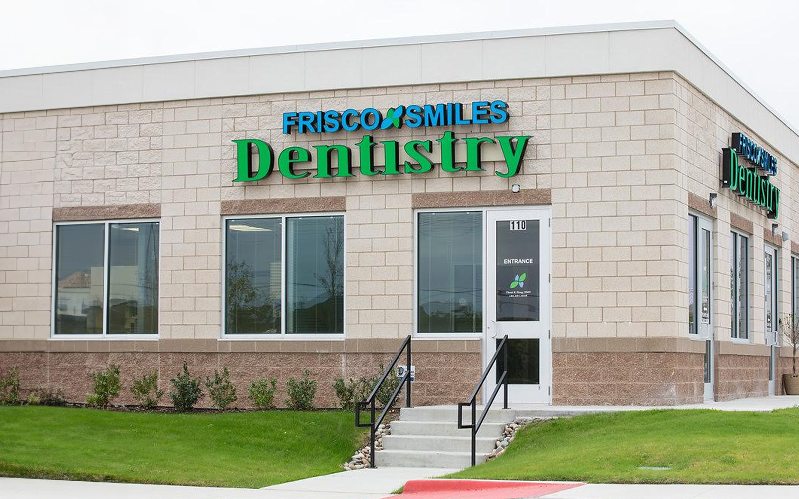 The image shows a dental clinic with a sign reading Fresco Smiles Dentistry and a logo indicating it s an FDA-approved facility, located outside during daylight hours.